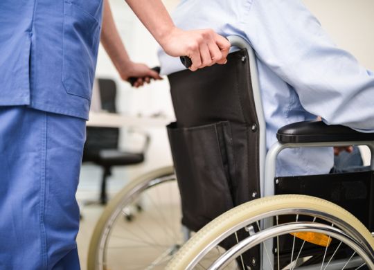 Nurse pushing a wheelchair